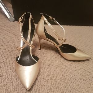 Gold leather pumps